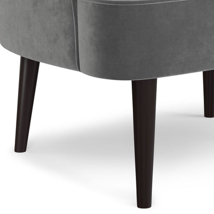 Upholstered accent chair with curved back in gray fabric and dark wooden legs on Tampa Home & Garden Store