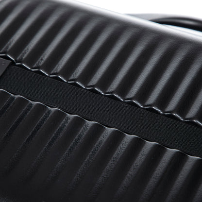 Black ABS luggage shell close-up with ribbed texture and fabric strap, from HouseOfZazla on Tampa Home & Garden Store