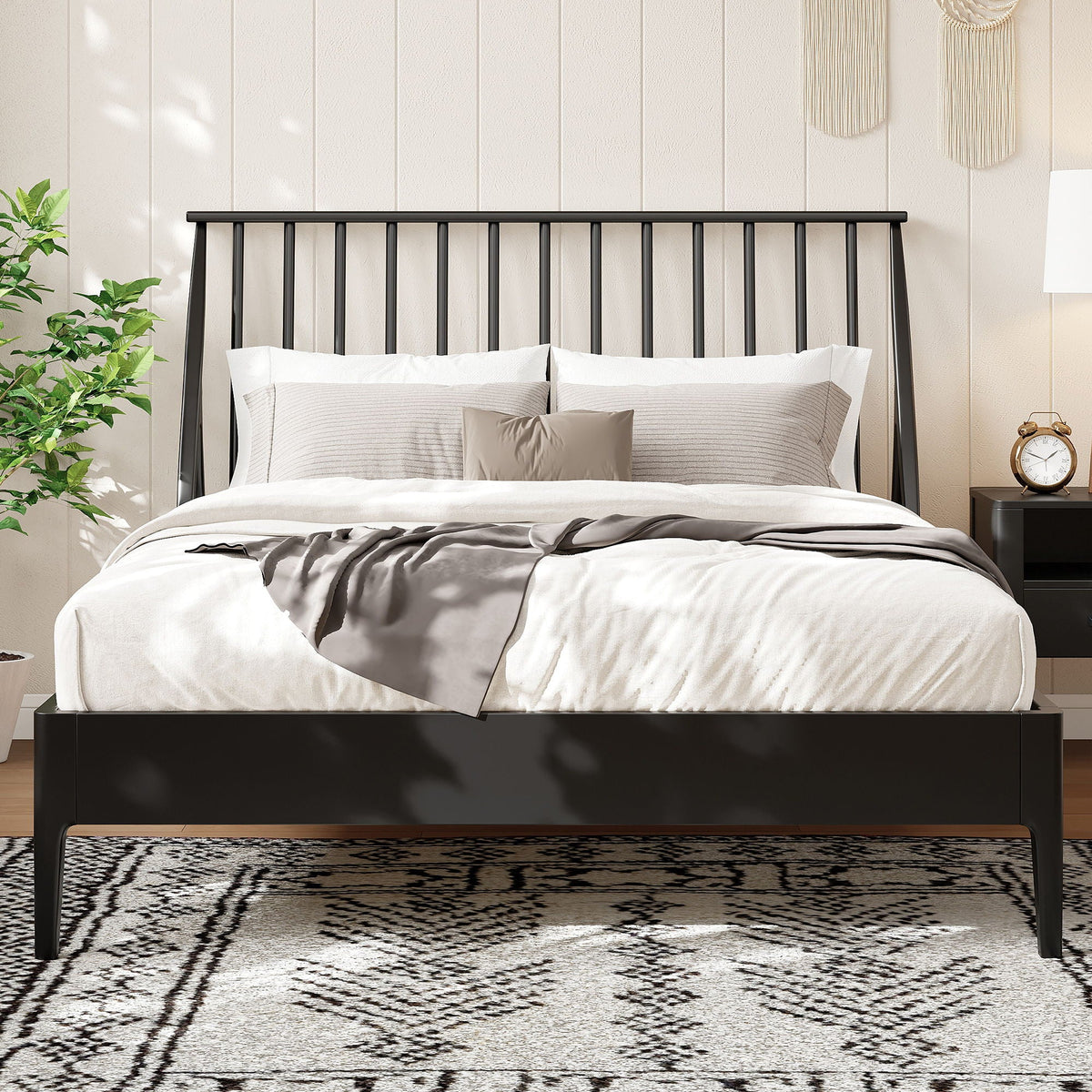 Bohemian platform bed with tall black metal headboard, white bedding and two pillows on Tampa Home & Garden Store