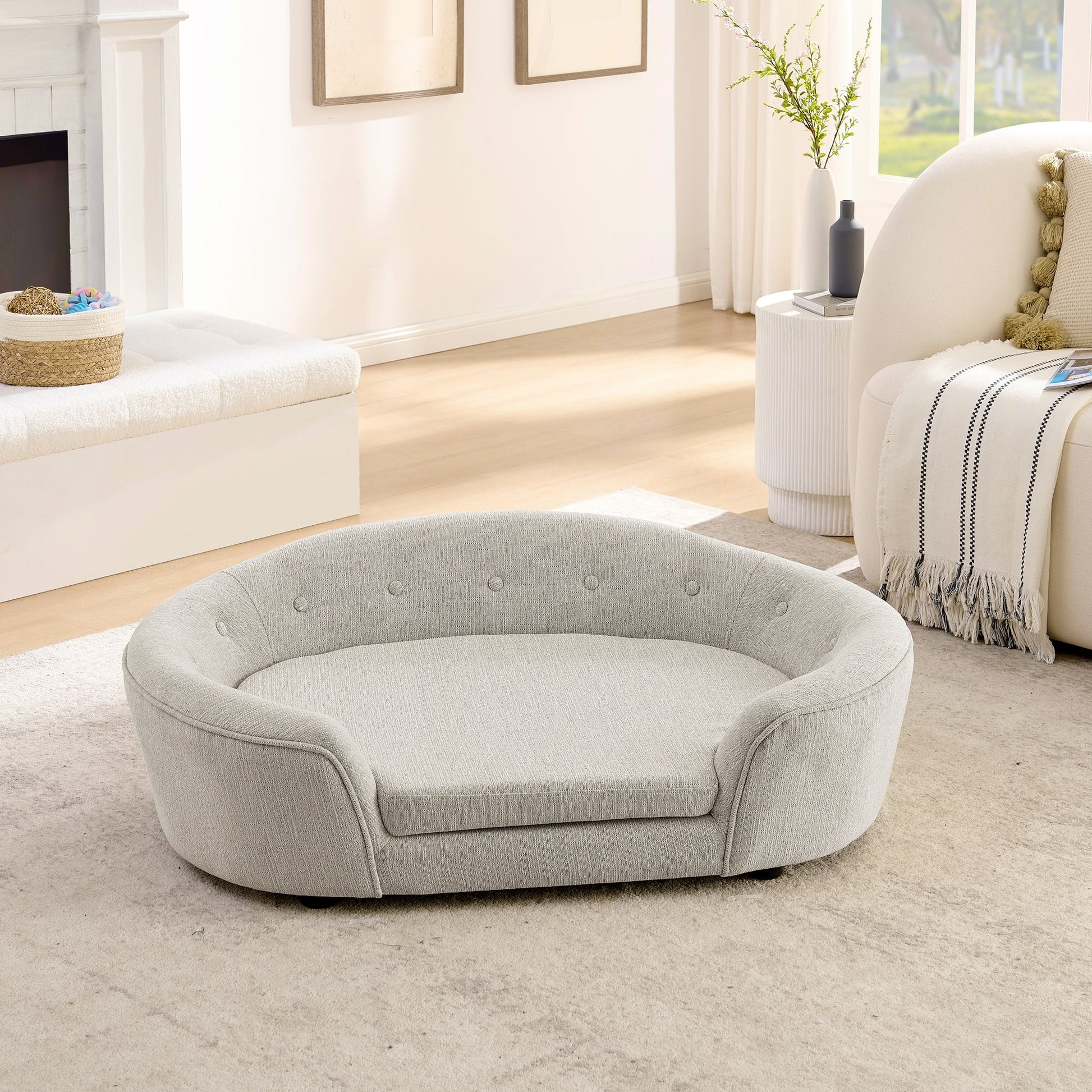 Oversized oval semi-enclosed dog sofa in beige linen with button tufted back on Tampa Home & Garden Store
