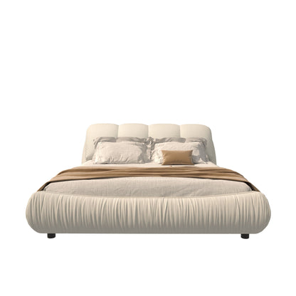 Beige upholstered platform bed with oversized padded backrest and wood frame on Tampa Home & Garden Store