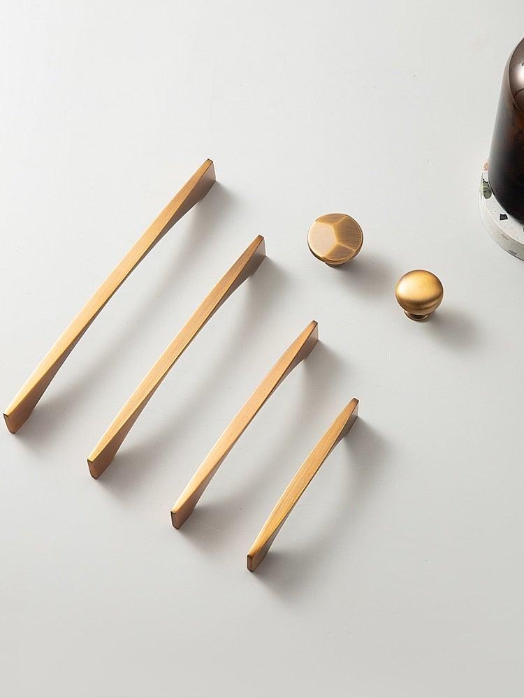 Six-piece brushed brass cabinet pulls and knobs set with minimalist handles and round knobs on Tampa Home & Garden Store