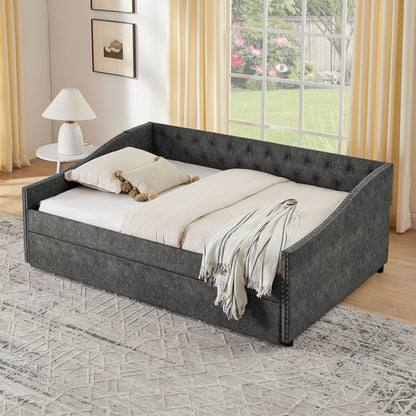 Upholstered gray daybed with tufted sides and nailhead trim, white bedding in a bright room on Tampa Home & Garden Store
