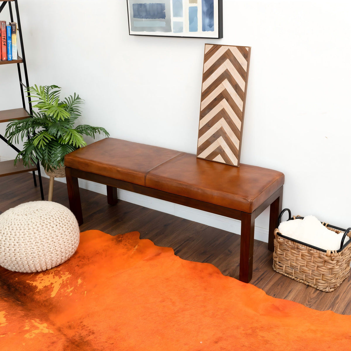 Antique brown upholstered bench with solid wood frame and leather seat on hardwood floor on Tampa Home & Garden Store