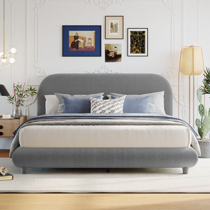 Upholstered platform bed in gray fabric with a thick curved frame by HouseOfZazla on Tampa Home & Garden Store