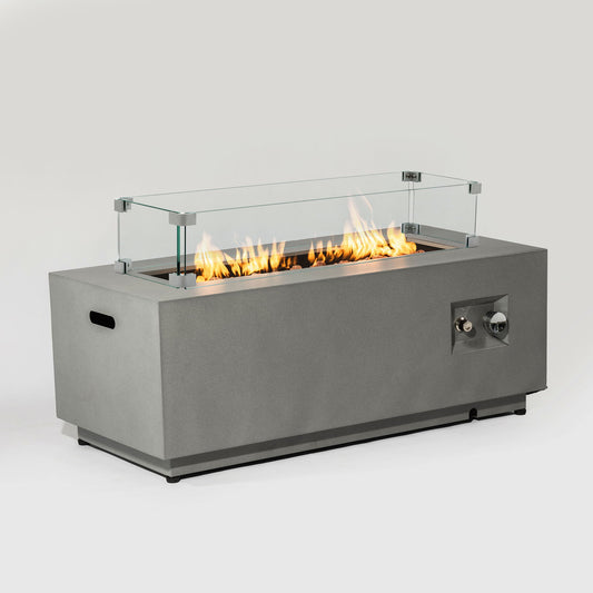Propane gas fire pit table with glass wind guard in gray metal base showing bright flames on Tampa Home & Garden Store