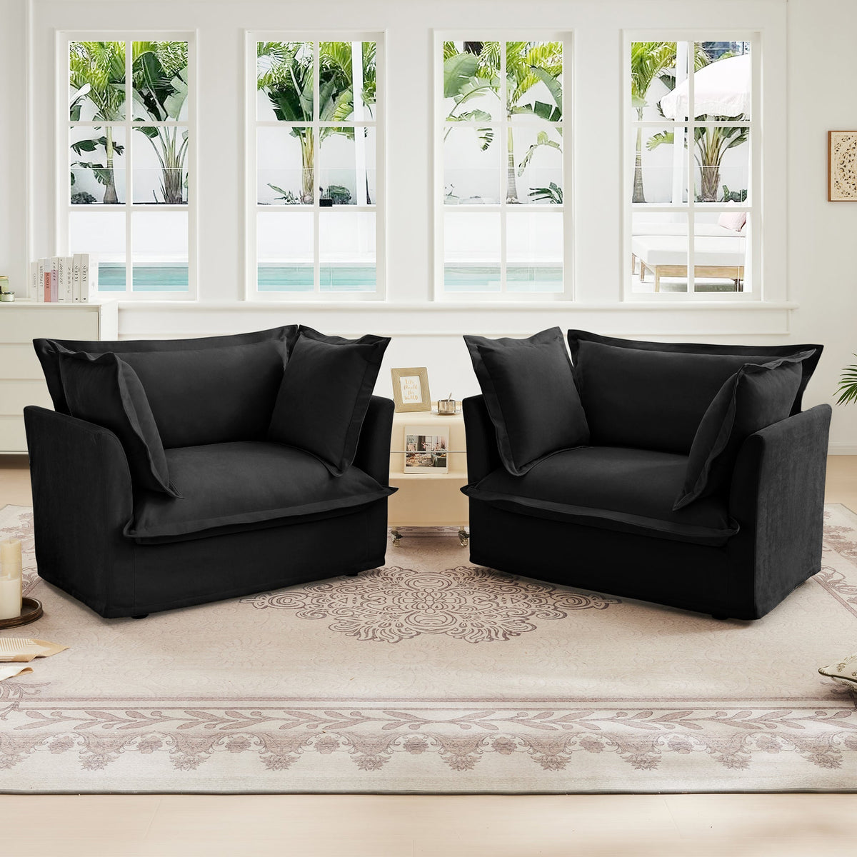 Set of 2 black slipcovered armchairs by HouseOfZazla in a bright living room on Tampa Home & Garden Store