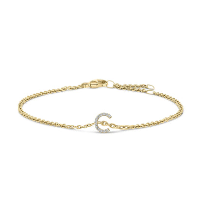 Gold-tone chain bracelet with a pavé diamond A initial charm and lobster clasp on Tampa Home & Garden Store