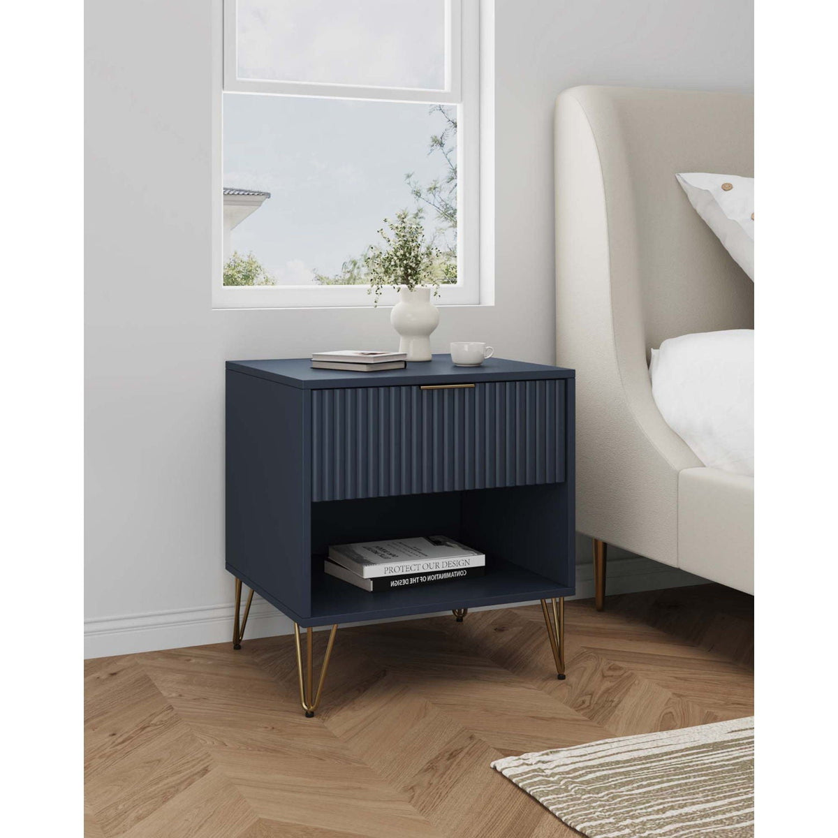 Modern navy blue nightstand with fluted drawer front, brass handle, and gold legs on Tampa Home & Garden Store