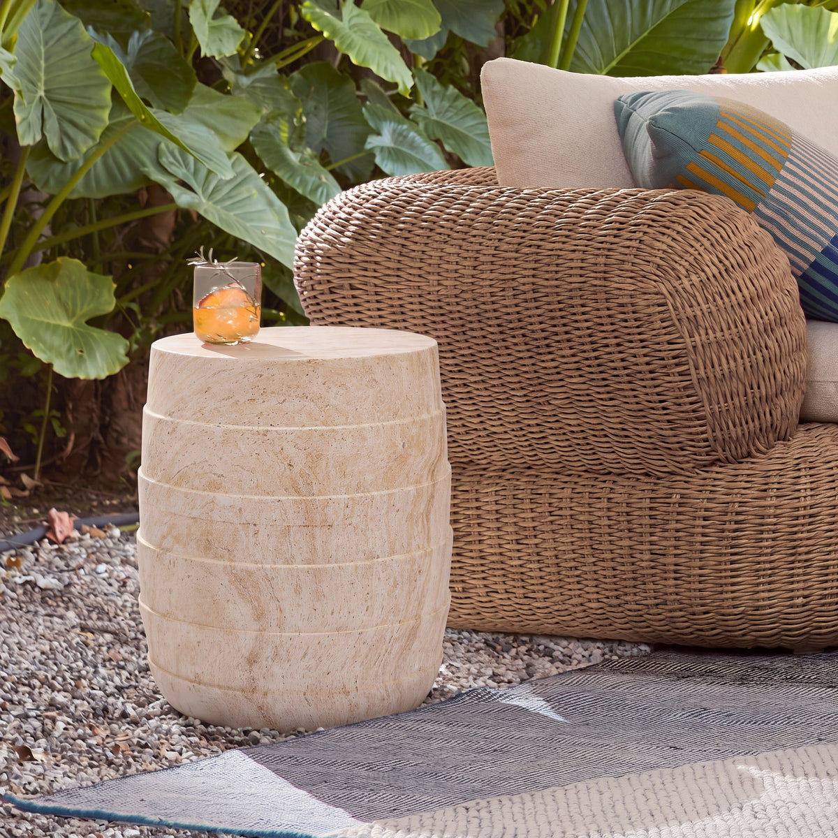Travertine-look cylindrical outdoor side table with ribbed texture in light beige on Tampa Home & Garden Store