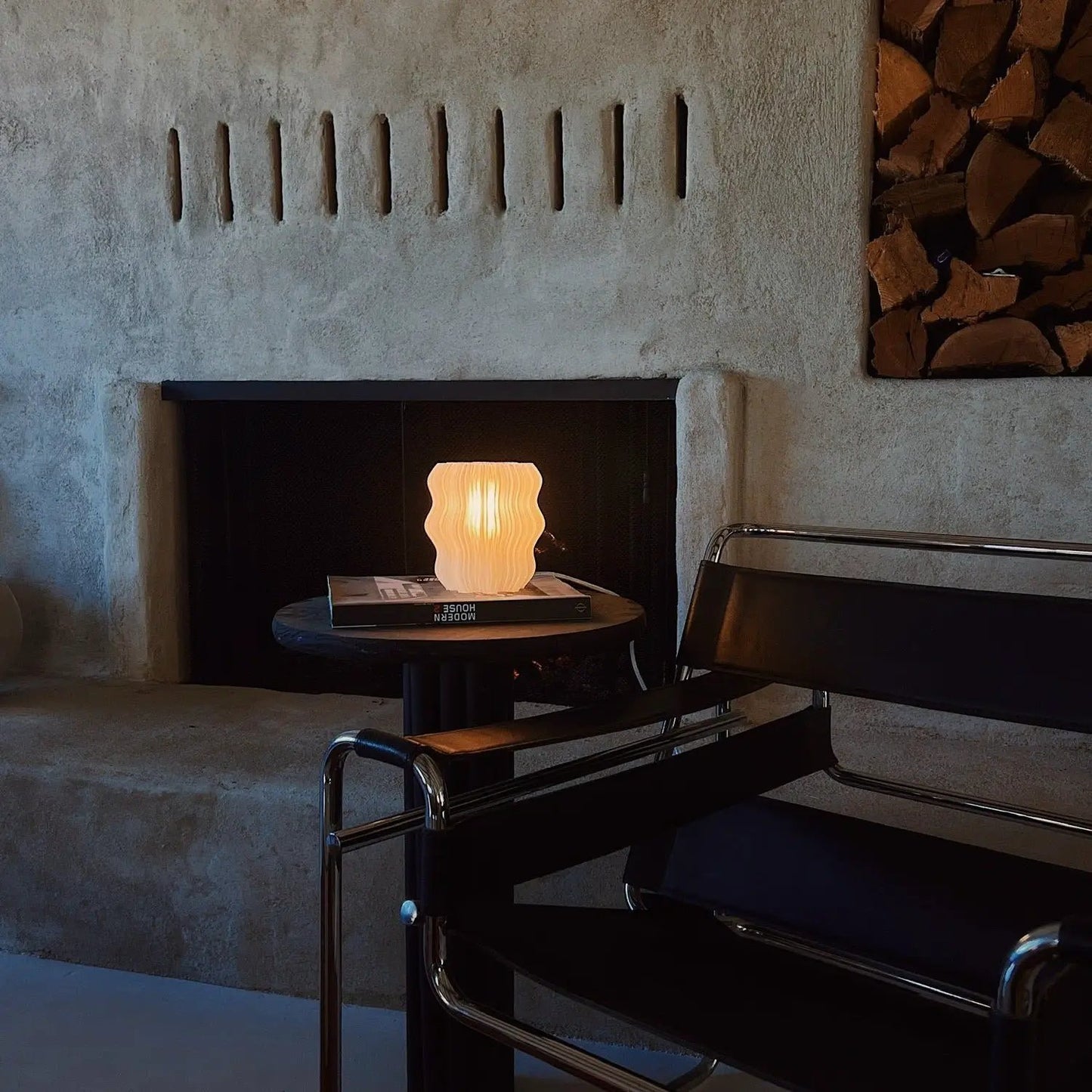 Mini Wavy Lamp for Ambient Atmosphere on round table beside modern chair in cozy living room on Tampa Home & Garden Store