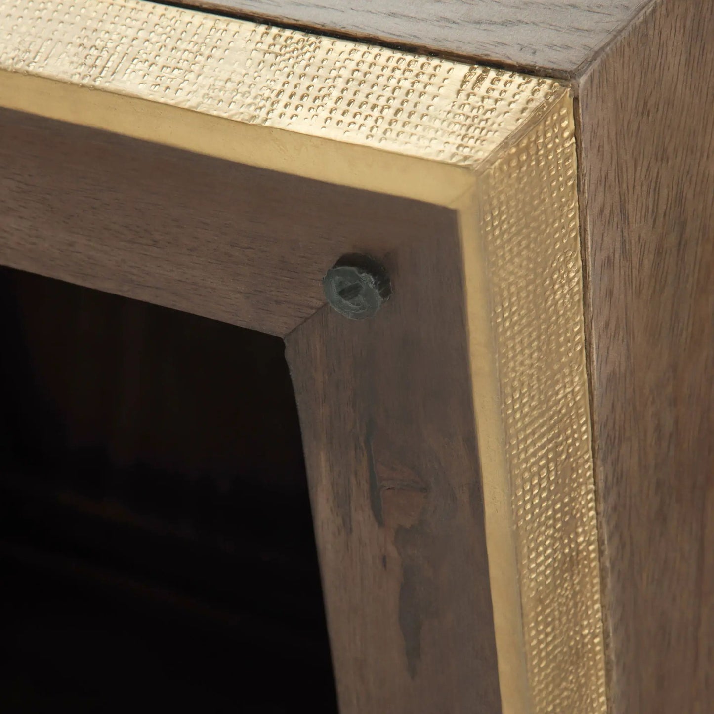 Abba handcrafted coffee table with gold hammered metal trim on dark wood on Tampa Home & Garden Store