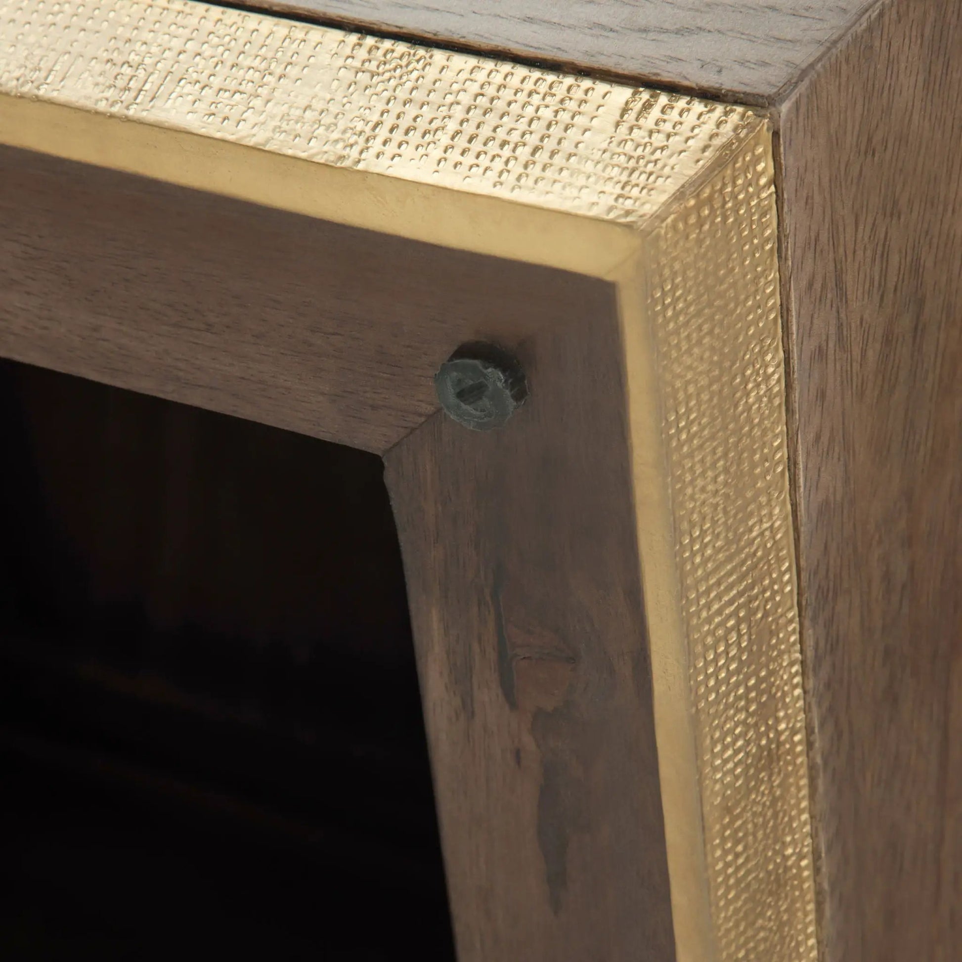 Abba handcrafted coffee table with gold hammered metal trim on dark wood on Tampa Home & Garden Store