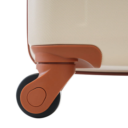 Luggage strap by HouseOfZazla over a beige textured suitcase with brown leather accents on Tampa Home & Garden Store