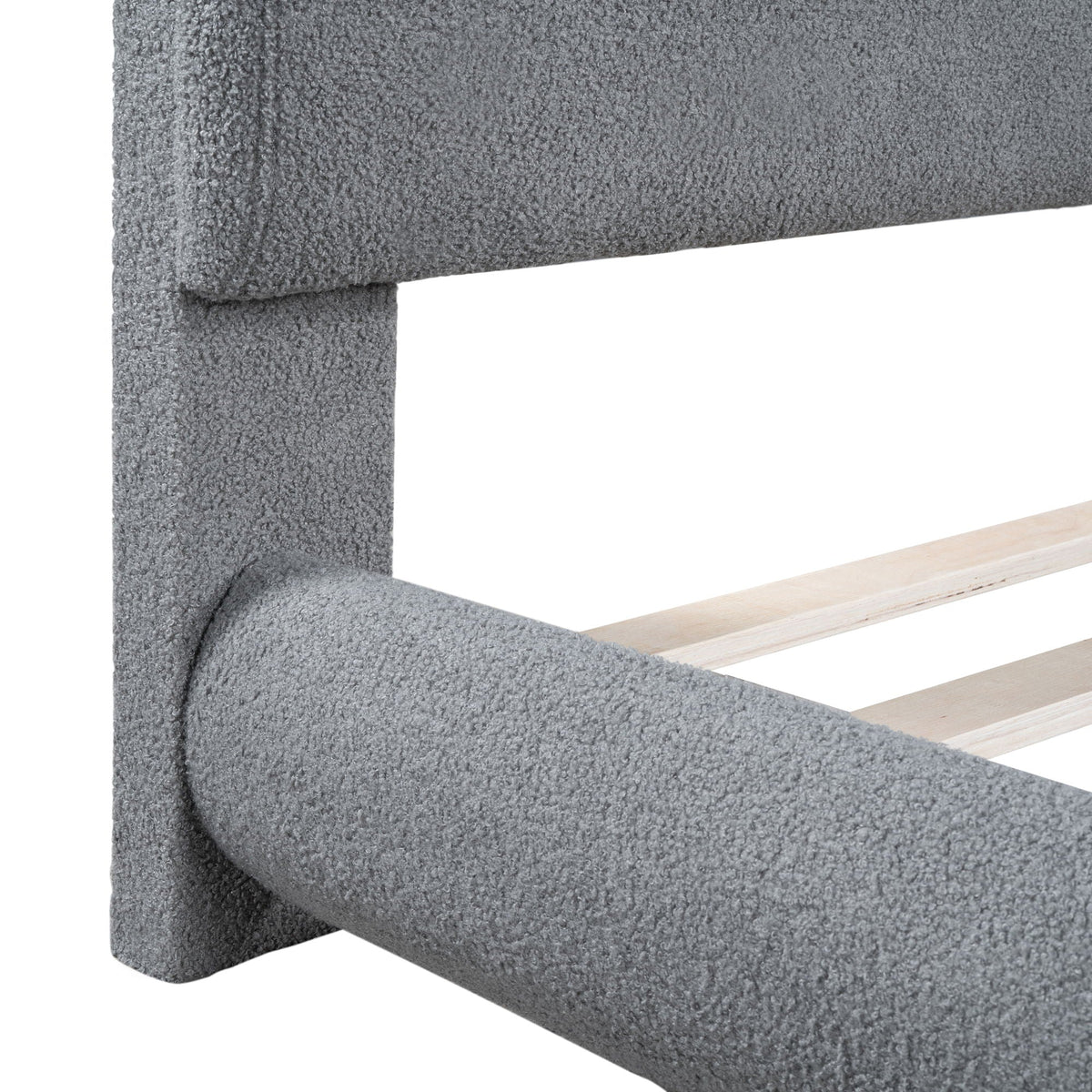 Upholstered platform bed frame in gray fabric with thick rails and exposed wood slats on Tampa Home & Garden Store