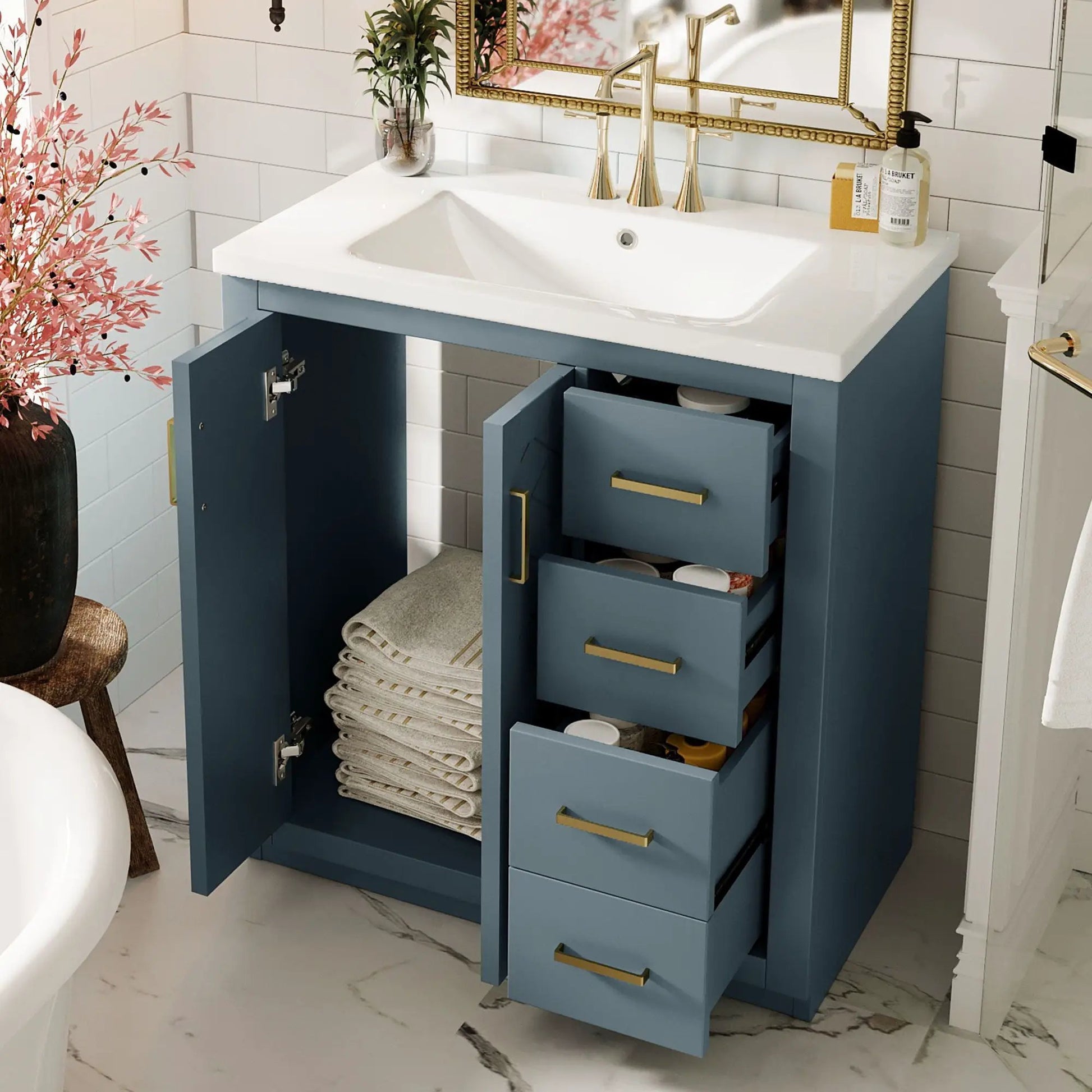 Bathroom vanity with sink, blue freestanding unit with 3 drawers and doors, gold hardware on Tampa Home & Garden Store