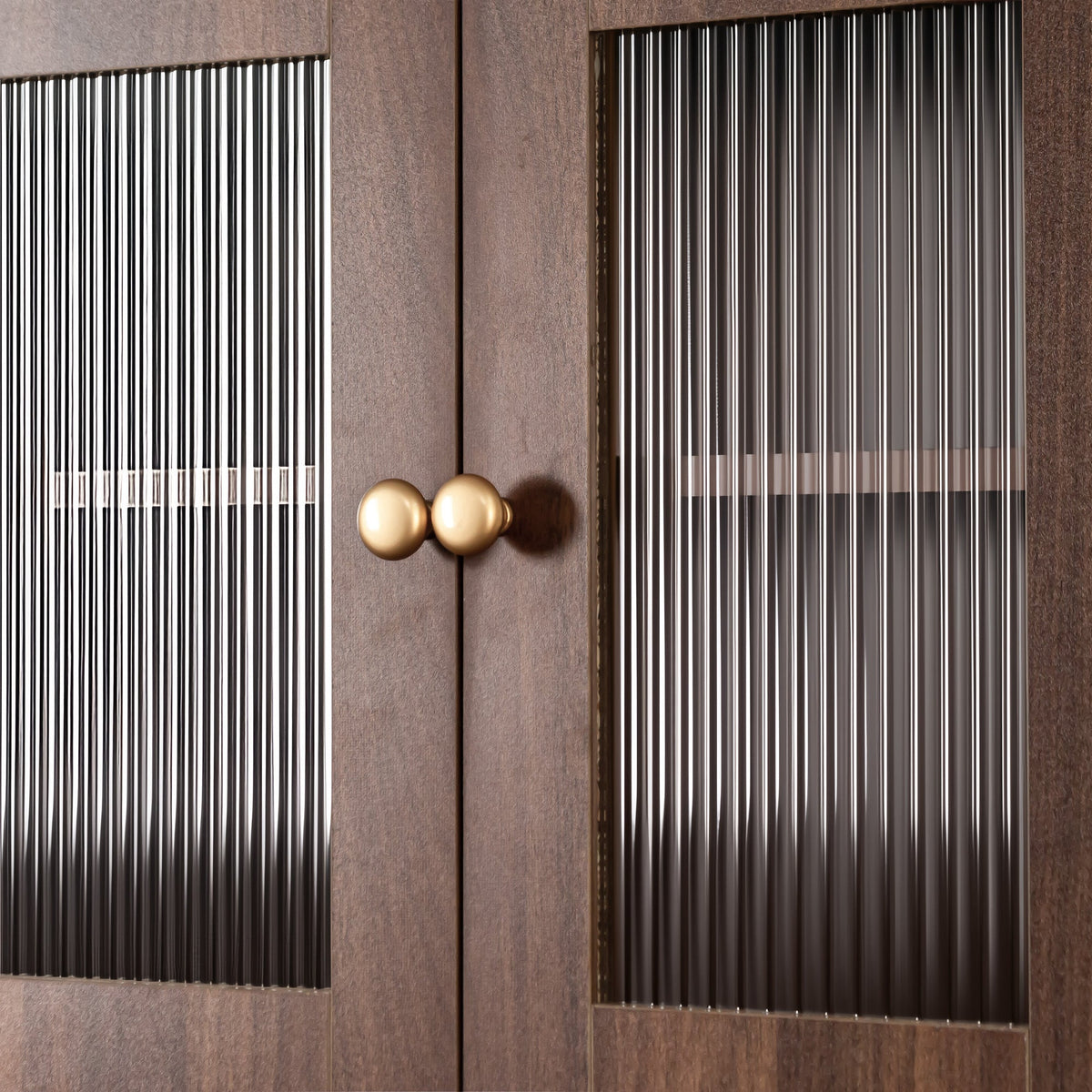 Kitchen pantry hutch storage cabinet in farmhouse brown with vertical glass panels and gold knobs on Tampa Home & Garden Store