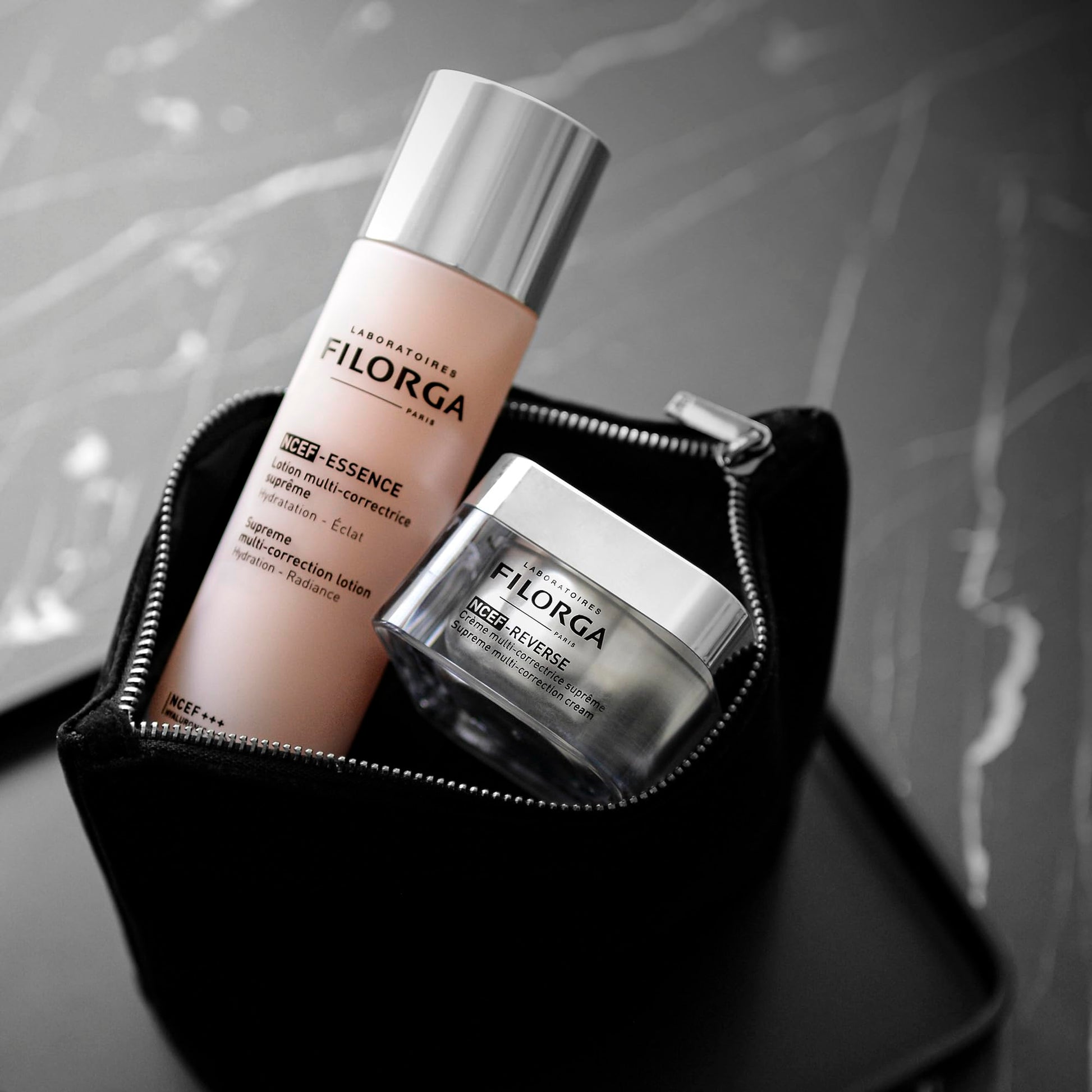 Filorga NCTF Essence Supreme regenerating lotion bottle with pink label black zip bag on Tampa Home & Garden Store