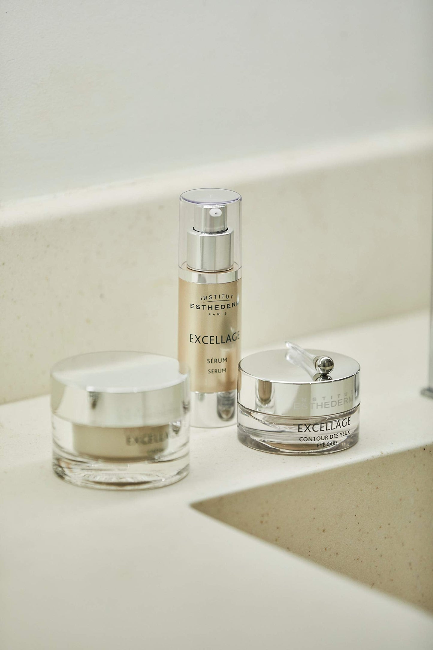 Institut Esthederm Excellage serum bottle beside Excellage eye cream on marble counter on Tampa Home & Garden Store