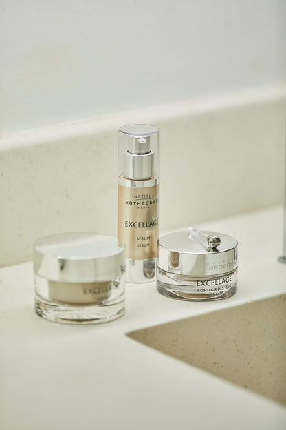 Institut Esthederm Excellage serum bottle beside Excellage eye cream on marble counter on Tampa Home & Garden Store
