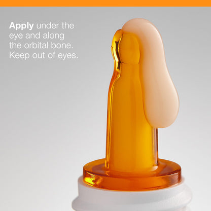 Dermalogica Biolumin-C Eye Serum bottle with orange dropper on gray backdrop on Tampa Home & Garden Store