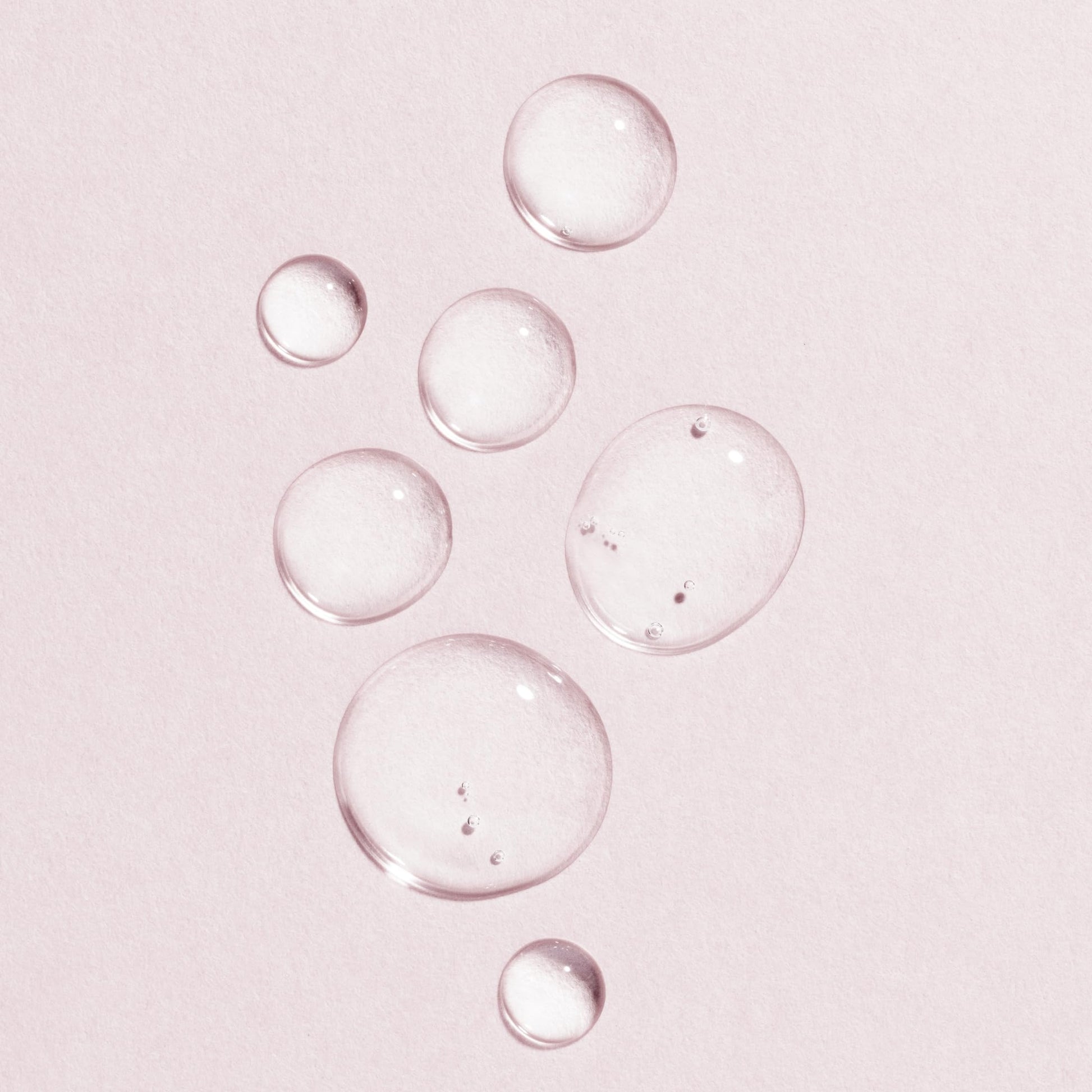 Face serum concept with pink droplets on pale pink background Lumene vegan collagen eye serum on Tampa Home & Garden Store