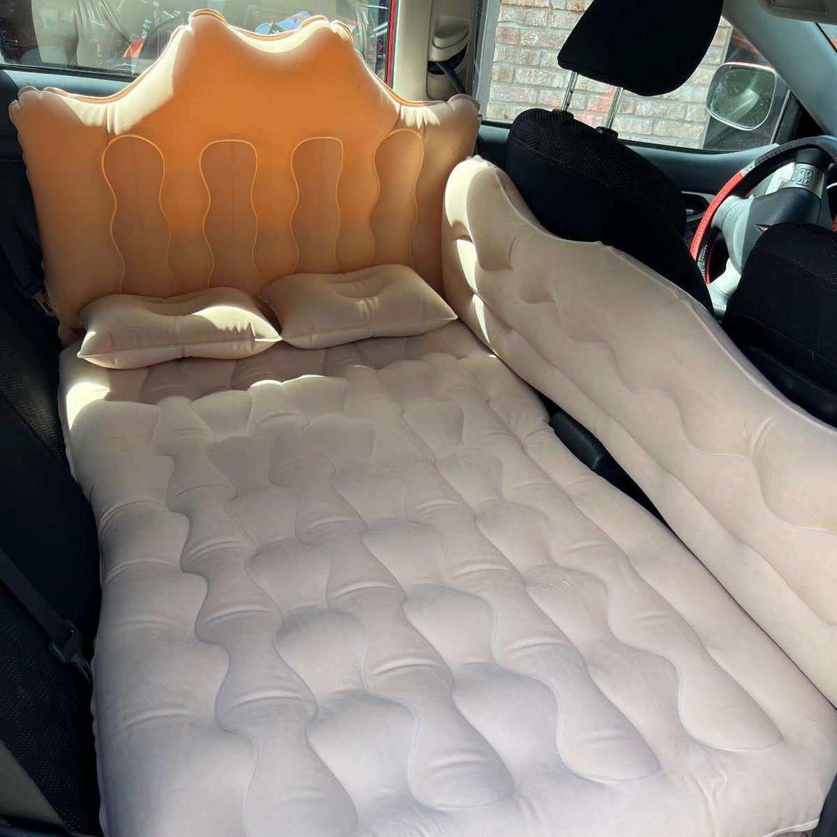 Umbrauto back seat car air mattress with beige top orange headrest cushion and two pillows on Tampa Home & Garden Store