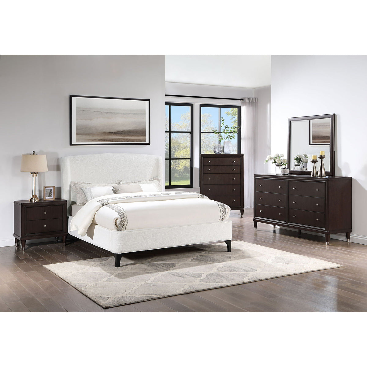 Theodore Wingback Bed in white upholstery with dark wood dresser setup and framed art on Tampa Home & Garden Store