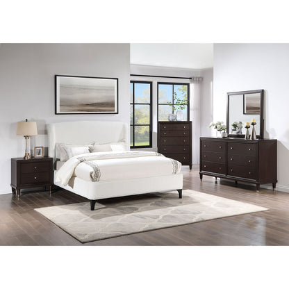 Theodore Wingback Bed in white upholstery with dark wood dresser setup and framed art on Tampa Home & Garden Store
