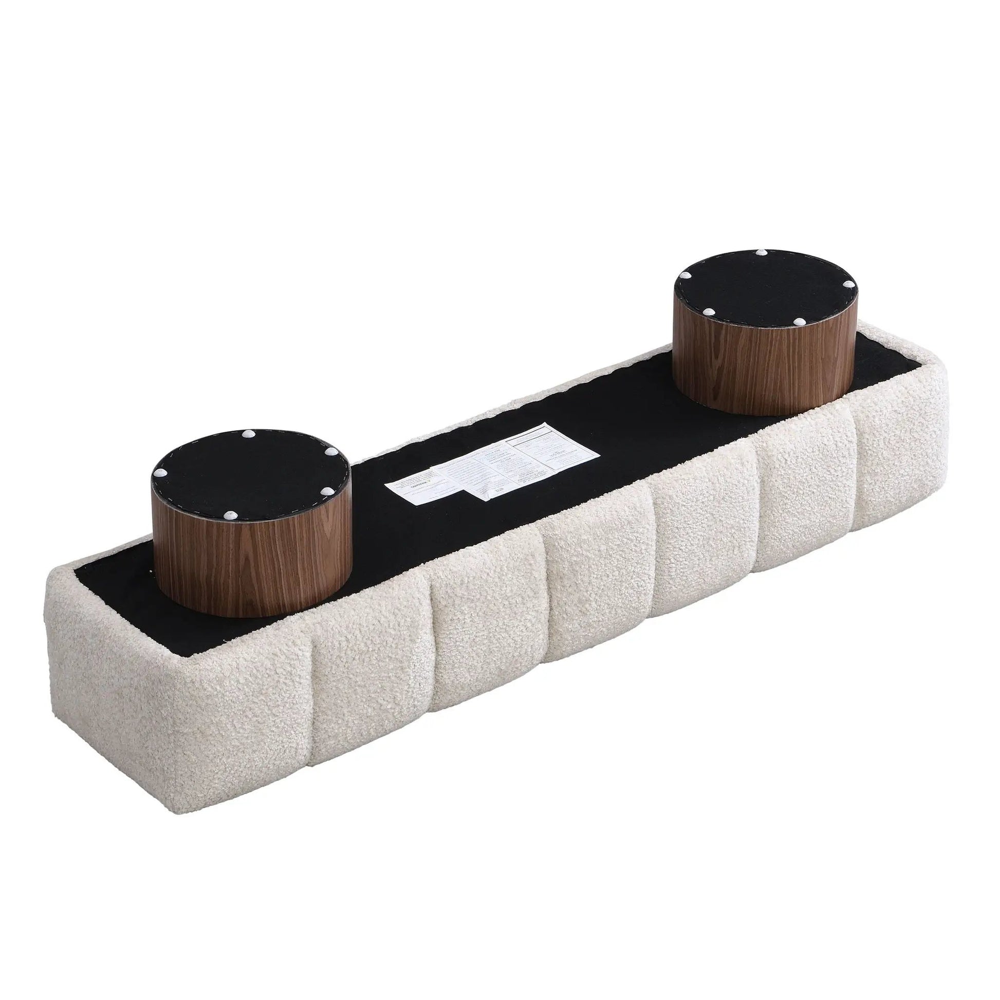 Upholstered dining bench in beige shag with 3 black round ottomans on pedestals on Tampa Home & Garden Store