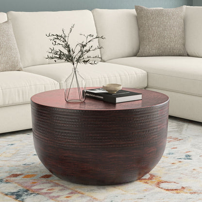 Handcrafted metal coffee table with textured circular ribbed detailing in dark brown on Tampa Home & Garden Store