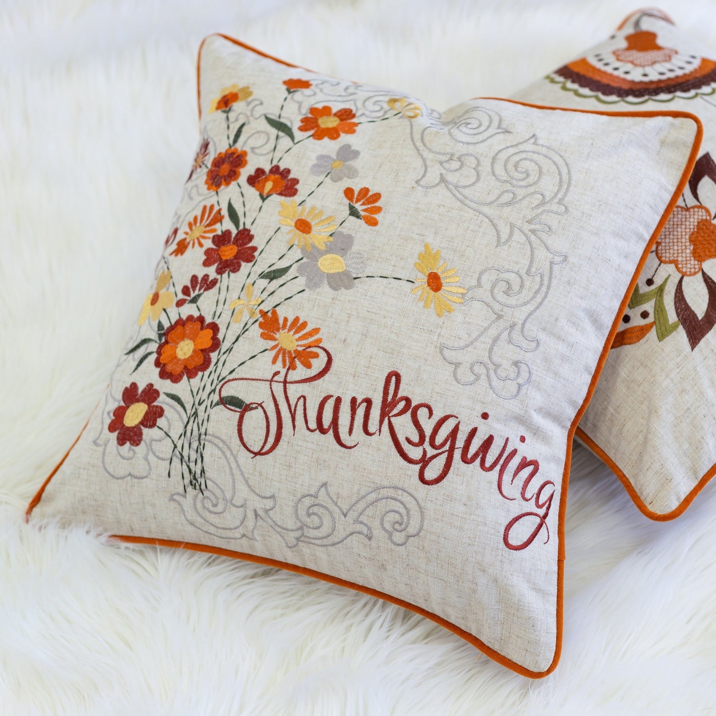 Thanksgiving Embroidered Floral Throw Pillow HouseOfZazla with orange piping on beige linen on Tampa Home & Garden Store