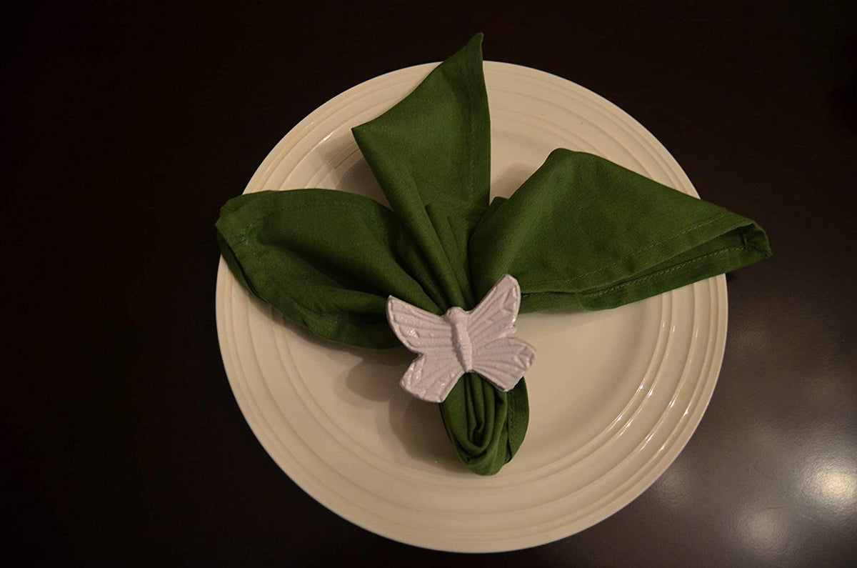 Vibhsa aluminum butterfly napkin ring securing a green napkin on a white plate on Tampa Home & Garden Store