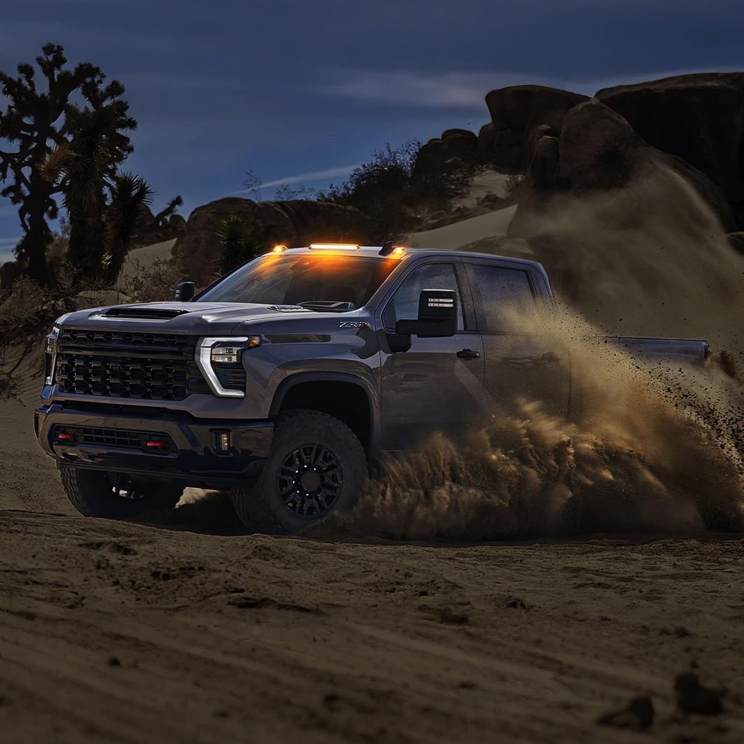 GMC Chevy HD smoked white amber LED roof cab lights on a lifted pickup in desert dusk on Tampa Home & Garden Store