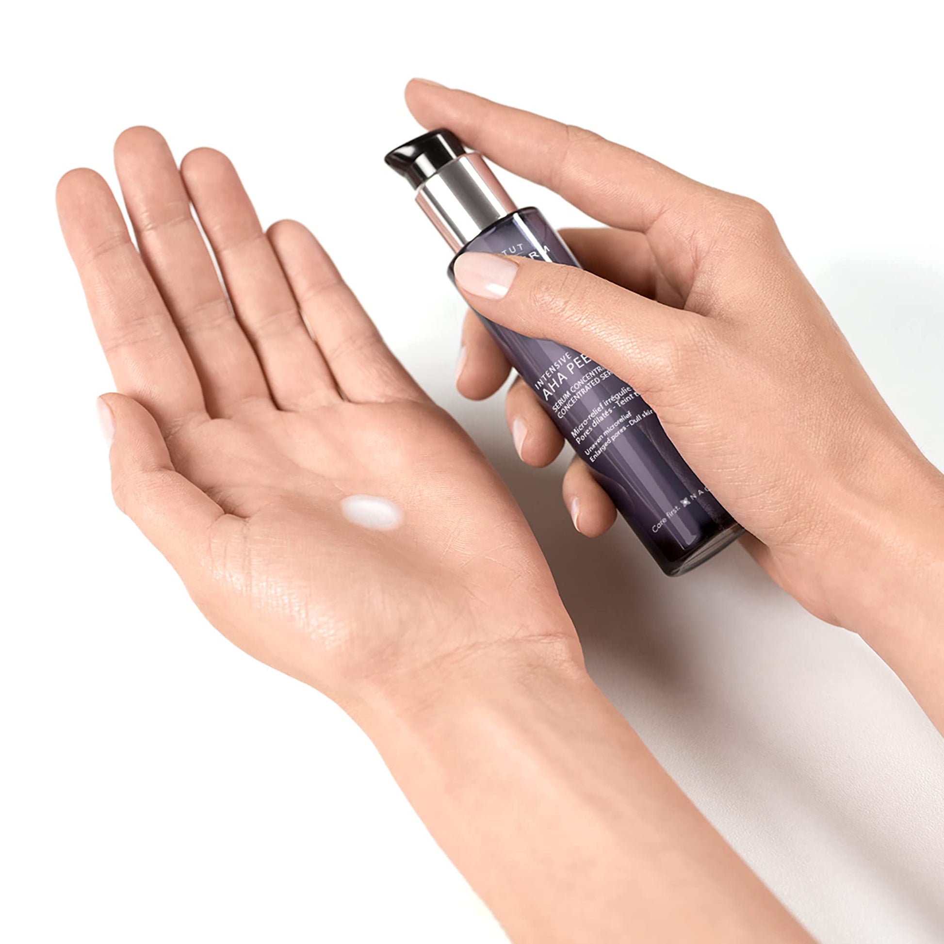 Institut Esthederm AHA Peel Gentle Serum bottle with purple glass and pump on Tampa Home & Garden Store