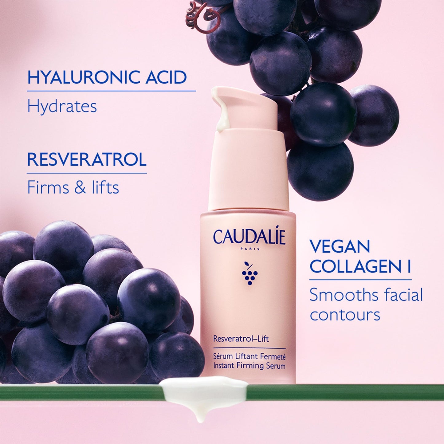 Caudalie Resveratrol Lift Firming Serum bottle with grape cluster on pink background on Tampa Home & Garden Store
