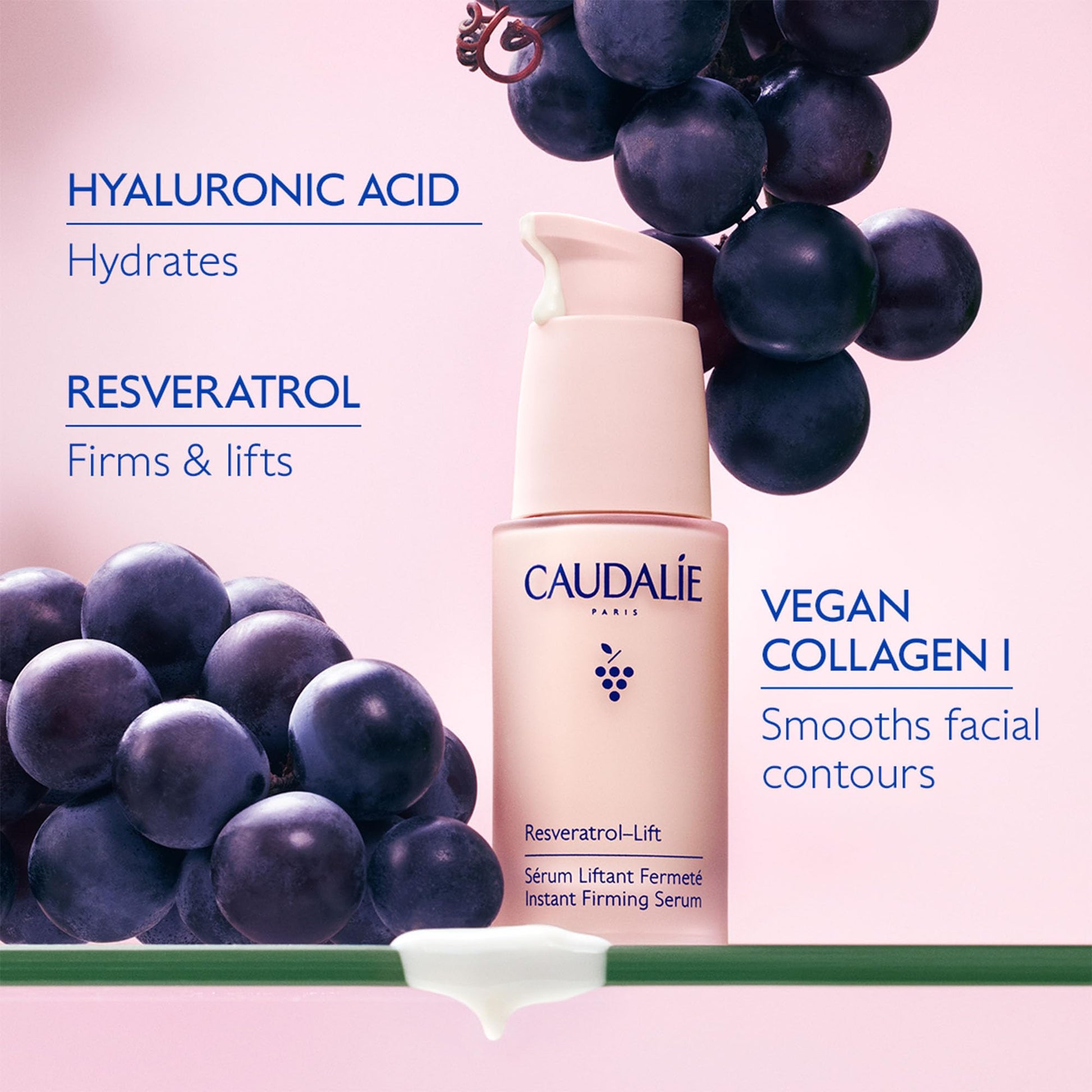 Caudalie Resveratrol Lift Firming Serum bottle with grape cluster on pink background on Tampa Home & Garden Store