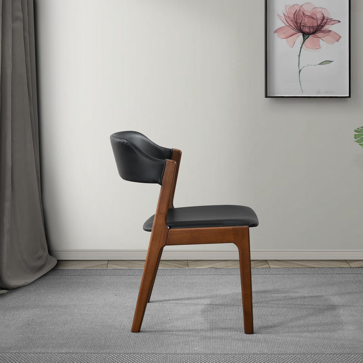 Enzo dining chair by HouseOfZazla with black vegan leather seat and back and brown wood legs on Tampa Home & Garden Store