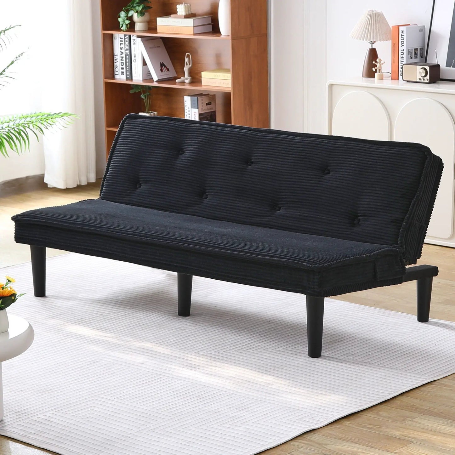 Versatile Sofa Bed With Solid Wood Frame in black tufted upholstery, modern living room setup on Tampa Home & Garden Store