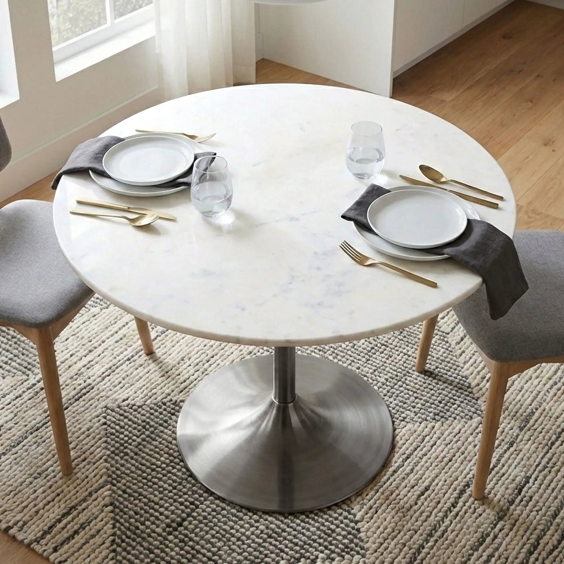 Osborne dining table round white marble top with metal pedestal base by Unique Piece Furniture on Tampa Home & Garden Store