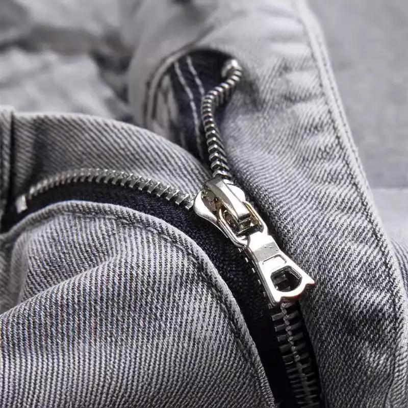 Men's gray denim jeans close-up featuring a metal zipper on Tampa Home & Garden Store