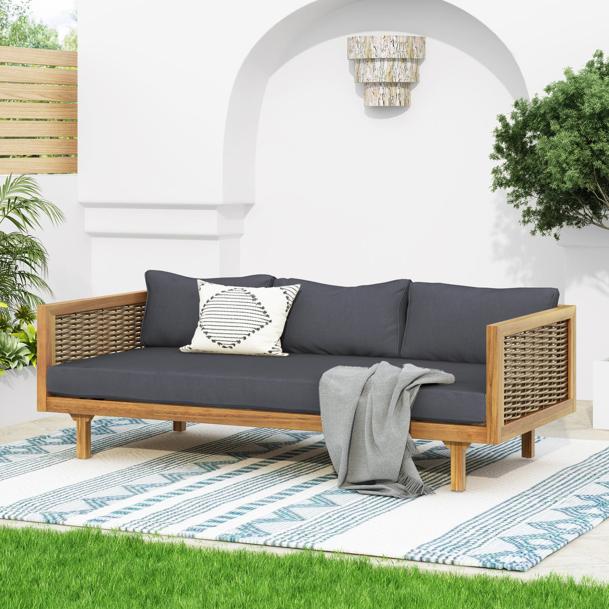 Claremont 3 Seater Daybed with Rattan Arms, dark gray cushions, wicker sides on a wooden frame on Tampa Home & Garden Store