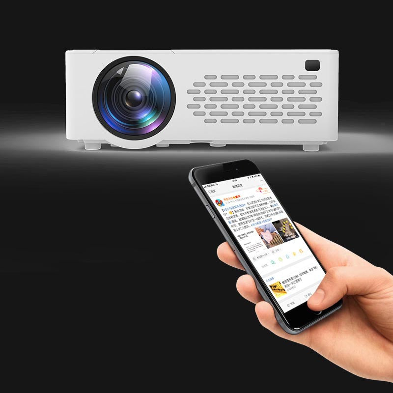White mini portable projector with large lens and vents, shown with a smartphone screen on Tampa Home & Garden Store