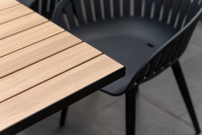 Panama dark rectangular table with light wood slats and black aluminum frame; 6 Nassau chairs on Tampa Home & Garden Store