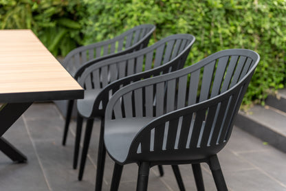 Panama Dark rectangular table with light wood top and six Nassau black aluminum chairs on Tampa Home & Garden Store