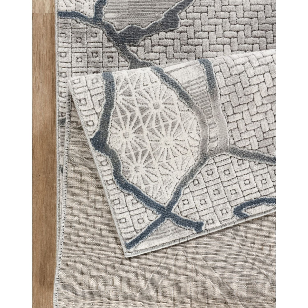 Contemporary geometric rug with gray texture by HouseOfZazla, two-layered display on Tampa Home & Garden Store