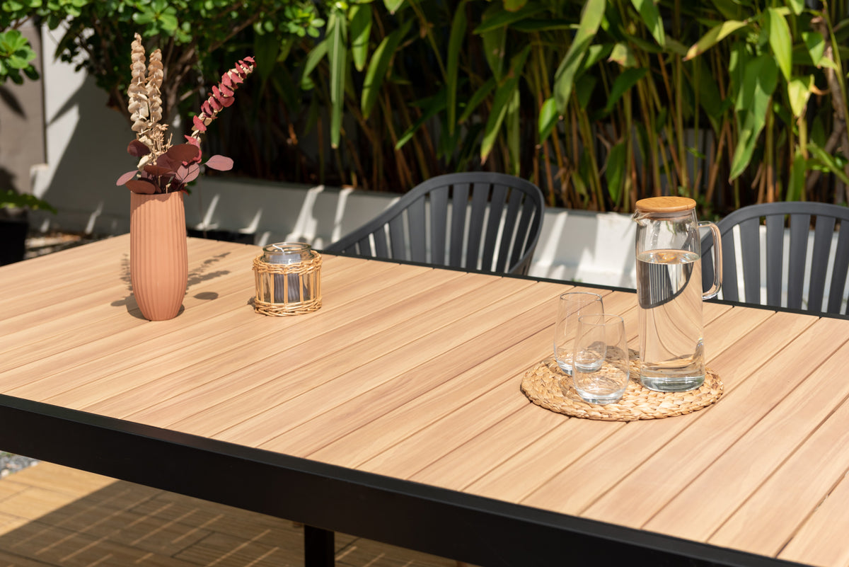 Portals dark rectangular teak table with 6 Nassau black aluminum dining chairs LifestyleGarden on Tampa Home & Garden Store