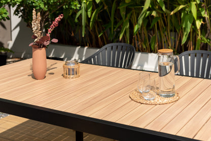 Portals dark rectangular teak table with 6 Nassau black aluminum dining chairs LifestyleGarden on Tampa Home & Garden Store