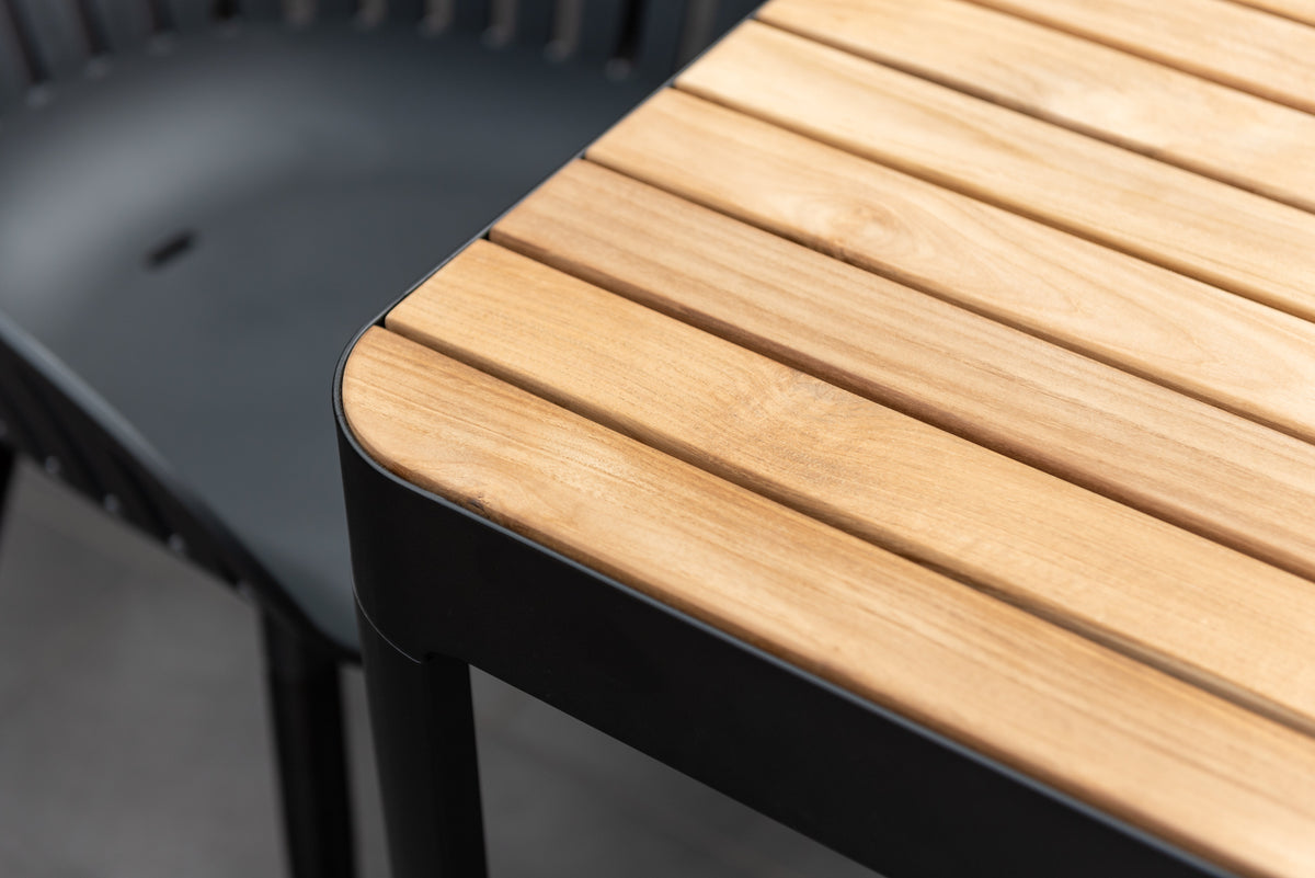 Portals dark rectangular teak table with slatted top and black aluminum frame on Tampa Home & Garden Store