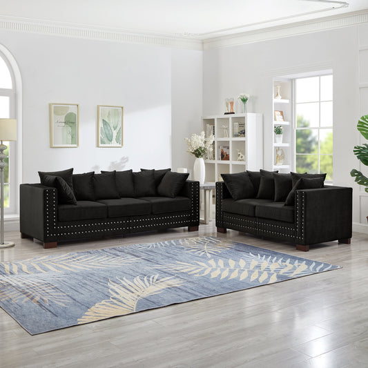 Sofas 2+3 seater black leather set by HouseOfZazla with nailhead trim in living room on Tampa Home & Garden Store
